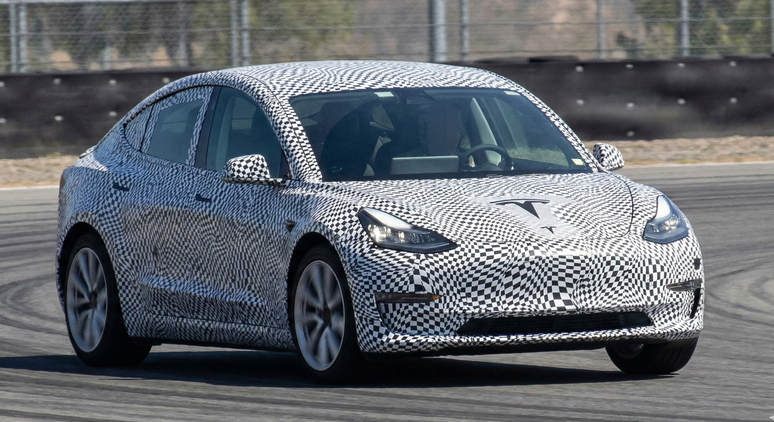Camouflaged Tesla Model 2 2026 hatchback prototype spy shot